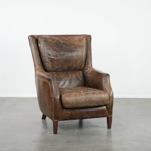 Zeer comfortabele vintage rundleren fauteuil met karakter en prachtige en sprekende kleuren