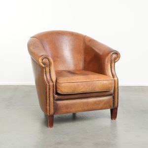 Vintage schapenleren clubfauteuil met een stoere uitstraling