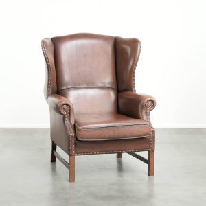 Comfortabele rundleren oorfauteuil in Engelse stijl met een tijdloze uitstraling